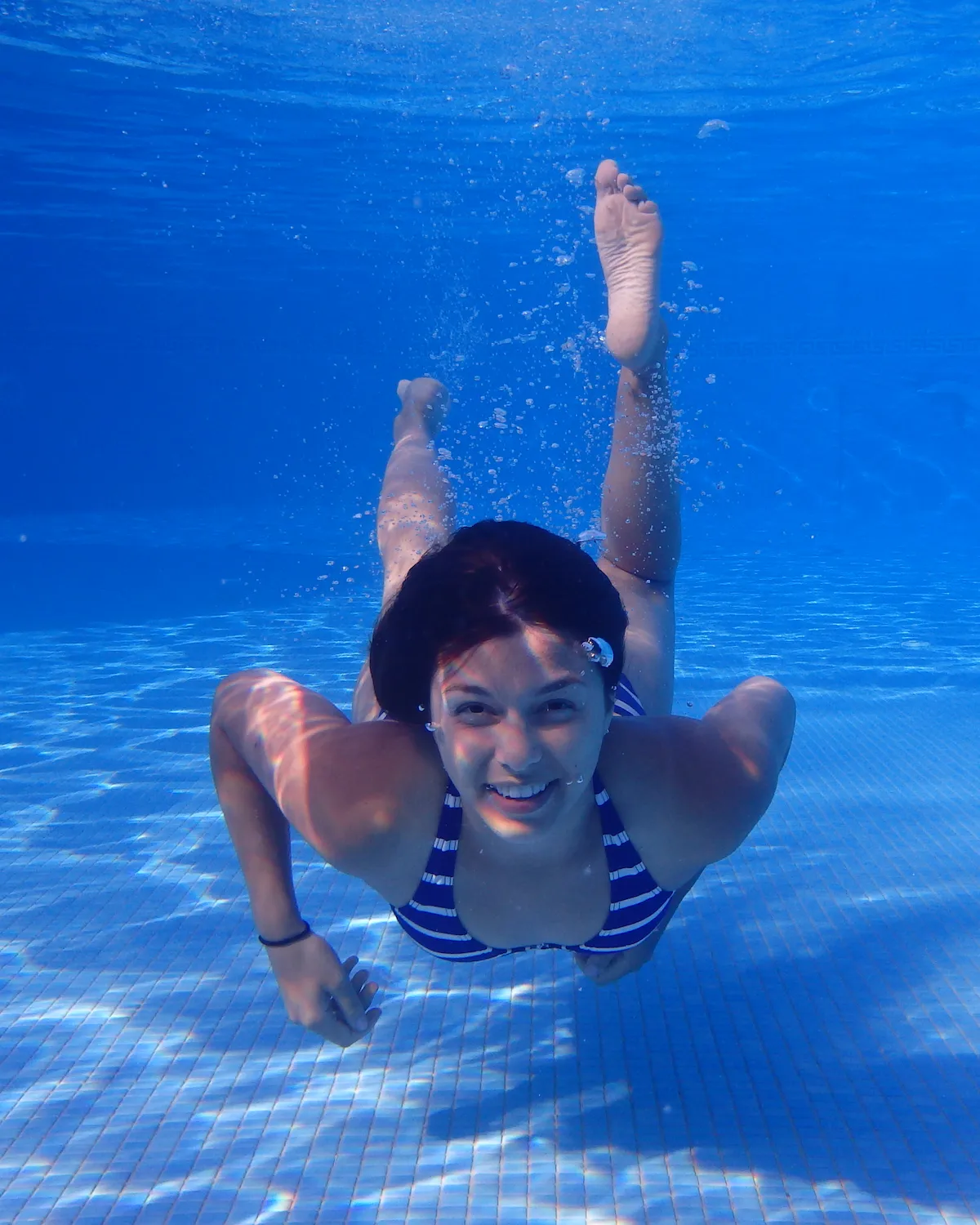 Hollie swimming, which is a gentle, low-impact movement suitable for building strength with hypermobility.